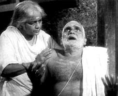 Still from Piravi — an elderly father waits